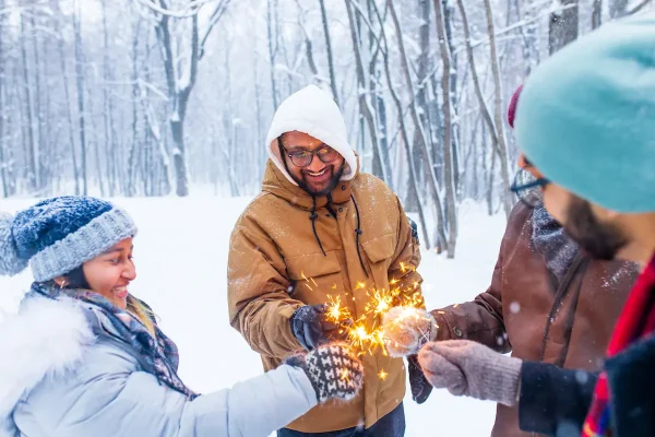 friends with sparklers in the winter.